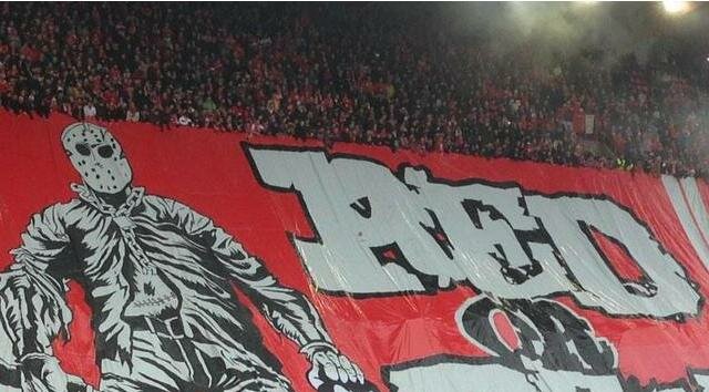 Standard Liege Fans Depict Horrific Image of Former Player With Banner in Stands