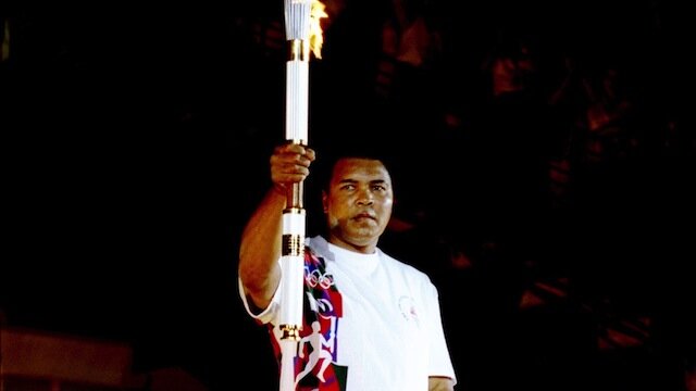 19 Jul 1996: Muhammad Ali holds the torch before lighting the Olympic Flame during the Opening Cere