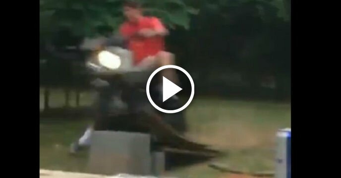 Moron on Moped Attempts to Go Up a Ramp, Ends Up Smashing Head-First Into Brick Wall