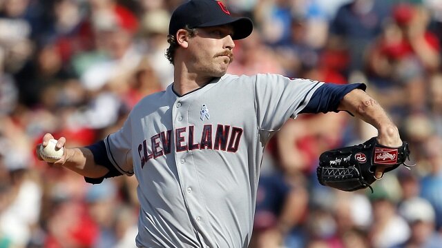 Cleveland Indians relief pitcher John Axford (44) throws a pitch against the Boston Red Sox in the ninth inning at Fenway Park. 