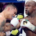 Floyd Mayweather Jr. lands punch on Marcos Maidana during WBC/WBA welterweight unification fight