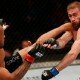 Demetrious Johnson kicks Ali Bagautinov during UFC 174 flyweight title fight