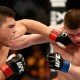 Kelvin Gastelum lands punch on Rick Story during exciting battle at UFC 171