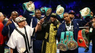Floyd Mayweather poses with all of his belts after win