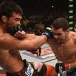 Chris Weidman lands punch on Lyoto Machida during UFC 175 middleweight title clash