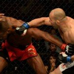 Glover Teixeira punches Jon Jones during light heavyweight title bout at UFC 172