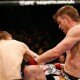 Mike Pyle lands knee on T.J. Waldburger during UFC 170 welterweight contest