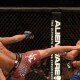 Alex Caceres lands kick on Urijah Faber during UFC 175 bantamweight battle