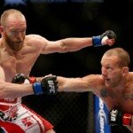 Gray Maynard punches T.J. Grant during lightweight battle at UFC 160