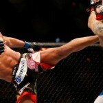 Lyoto Machida lands kick on Chris Weidman during UFC 175 middleweight title clash