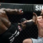 Melvin Manhoef lands kick on Brock Larson during One FC event in Singapore