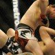 Mike Pyle lands an elbow against T.J. Waldburger during UFC 170 welterweight fight