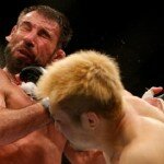 Takanori Gomi punches Isaac Vallie-Flagg during lightweight battle at UFC 172
