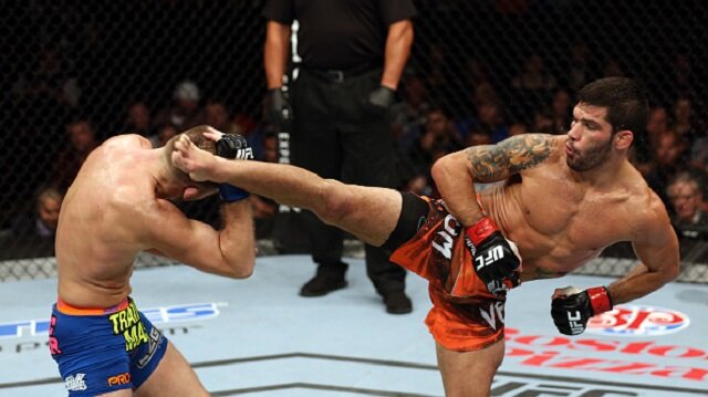 Raphael Assuncao lands kick to the head of Bryan Caraway at UFC Fight Night 54