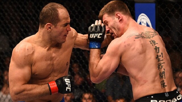 Junior dos Santos punches Stipe Miocic during heavyweight battle at UFC on FOX 13