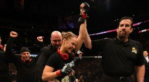 Ronda Rousey has hand raised in victory after beating Cat Zingano at UFC 184
