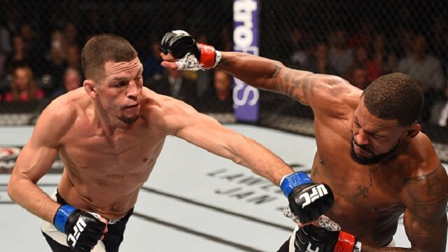 Nate Diaz lands punch on Michael Johnson during spirited lightweight clash at UFC on FOX 17
