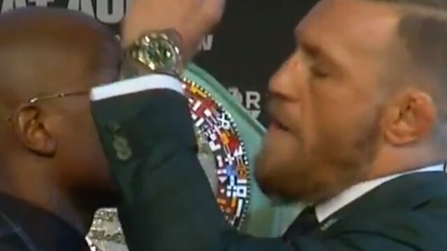 Conor McGregor Takes Sunglasses Off During Staredown With Floyd Mayweather Jr.