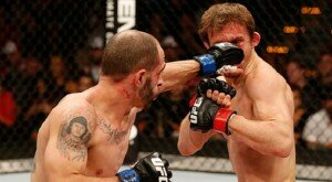 Chico Camus punches Brad Pickett during flyweight bout at UFC Fight Night 57