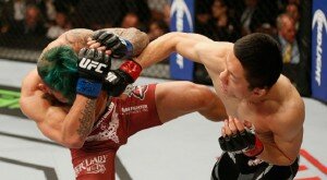 Kyoji Horiguchi punches Louis Gaudinot during UFC 182 flyweight battle