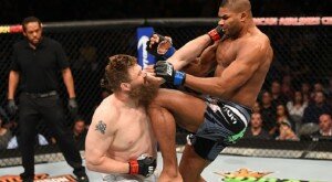 Alistair Overeem knees Roy Nelson during heavyweight action at UFC 185