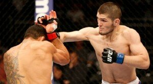Khabib Nurmagomedov punches Rafael dos Anjos during lightweight bout at UFC on FOX 11