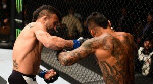 John Lineker punches Francisco Rivera during bantamweight action at UFC 191