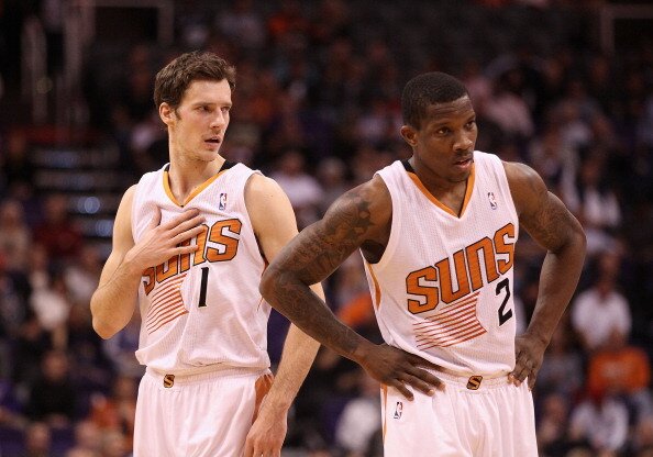 PHOENIX, AZ - DECEMBER 18: Goran Dragic #1 and Eric Bledsoe #2 of the Phoenix Suns await a free throw shot during the NBA game against the San Antonio Spurs at US Airways Center on December 18, 2013 in Phoenix, Arizona. The Spurs defeated the 108-101. NOTE TO USER: User expressly acknowledges and agrees that, by downloading and or using this photograph, User is consenting to the terms and conditions of the Getty Images License Agreement. (Photo by Christian Petersen/Getty Images)
