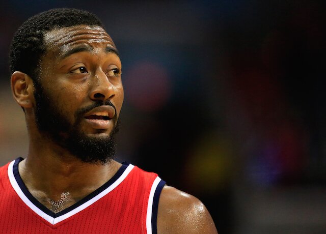 John Wall of the Washington Wizards looks on during the second half of the Wizards 99-91 loss to the Chicago Bulls at Verizon Center on December 23, 2014 in Washington, DC. (Photo by Rob Carr/Getty Images)