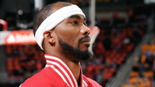 Corey Brewer #33 of the Houston Rockets stands on the court for the national anthem before a game against the Oklahoma City Thunderon January 15, 2015 at the Toyota Center in Houston, Texas. (Photo by Bill Baptist/NBAE via Getty Images)