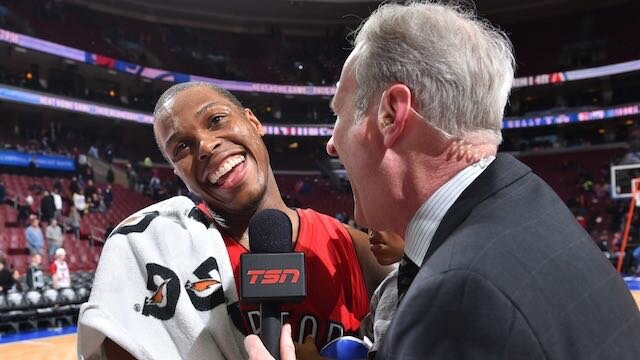 Kyle Lowry of the Toronto Raptors speaks with broadcaster Jack Armstrong of Canada's TSN after his team's 91-86 win over the Philadelphia 76ers at Wells Fargo Center on January 23, 2015 in Philadelphia, Pennsylvania. (Photo by Jesse D. Garrabrant/NBAE via Getty Images)