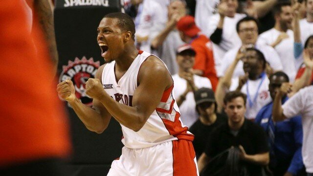 TORONTO,ON - APRIL 18: Kyle Lowry #7 of the Toronto Raptors reacts to a late game tying basket against the Washington Wizards during game one of their NBA Eastern Conference quarterfinal playoffs at the Air Canada Centre on April 18, 2015 in Toronto, Ontario, Canada. NOTE TO USER: User expressly acknowledges and agrees that, by downloading and/or using this photograph, user is consenting to the terms and conditions of the Getty Images License Agreement. Mandatory Copyright Notice: Copyright 2015 NBAE (Photo by Dave Sandford/NBAE via Getty Images)