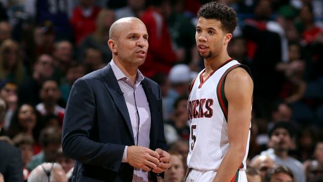 Jason Kidd talks to Michael Carter-Williams during a game