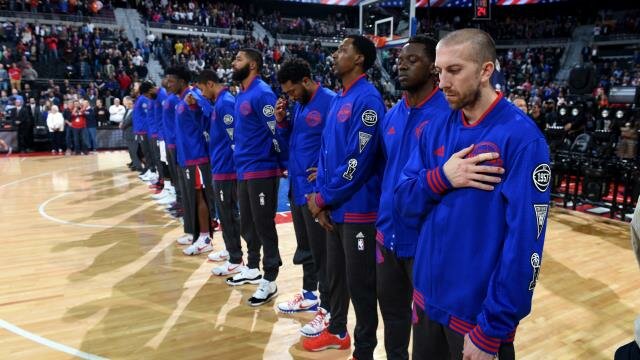 Detroit Pistons team lined up during the national anthem