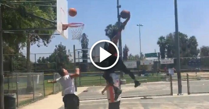 Suns' Derrick Jones Jr. Jumps Over Unsuspecting Civilian During #DriveByDunkChallenge
