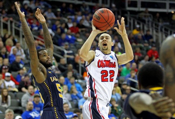 KANSAS CITY, MO - MARCH 24: Marshall Henderson #22 of the Mississippi Rebels attempts a shot in the second half against Ramon Galloway #55 of the La Salle Explorers during the third round of the 2013 NCAA Men's Basketball Tournament at Sprint Center on March 24, 2013 in Kansas City, Missouri. (Photo by Ed Zurga/Getty Images)