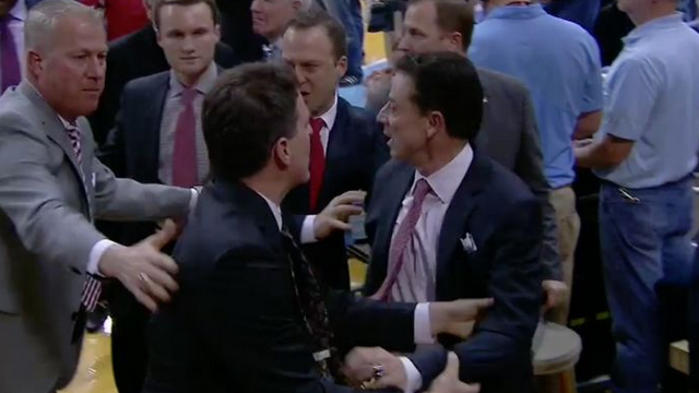 Louisville HC Rick Pitino Loses His Mind On North Carolina Fan — Has To Be Held Back
