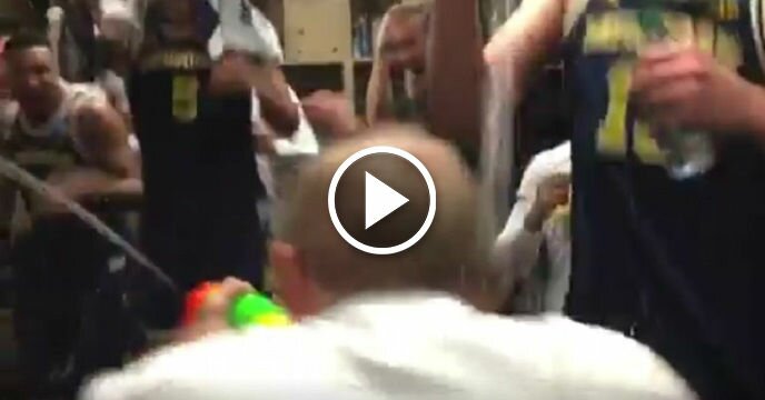 Michigan Head Coach John Beilein Unleashes Super Soaker on Players in Victory Celebration
