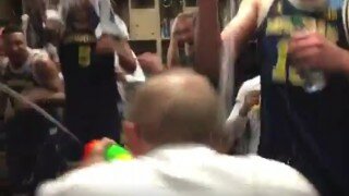 Michigan Head Coach John Beilein Unleashes Super Soaker on Players in Victory Celebration