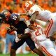 Clemson safety Robert Smith (27) and linebacker Stephone Anthony (42) take down Syracuse quarterback Terell Smith (10).