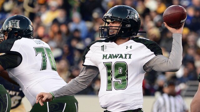 Nov 9, 2013; Annapolis, MD, USA; Hawaii Warriors quarterback Sean Schroeder (19) thaws a pass during the quarter of the Hawaii Warriors vs Navy Midshipmen game at Navy Marine Corps Memorial Stadium. Mandatory Credit: Tommy Gilligan-USA TODAY Sports