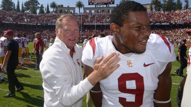 Sep 6, 2014; Stanford, CA, USA; Southern California Trojans athletic director Pat Haden (left) congratulates receiver JuJu Smith (9) after the game against the Stanford Cardinal at Stanford Stadium. USC defeated Stanford 13-10. Mandatory Credit: Kirby Lee-USA TODAY Sports