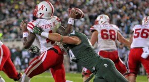 Oct 4, 2014; East Lansing, MI, USA; Michigan State Spartans defensive end Marcus Rush (44) hurries the throw of Nebraska Cornhuskers quarterback Tommy Armstrong Jr. (4) during the 2nd half of a game at Spartan Stadium. Mandatory Credit: MSU won 27-22. Mike Carter-USA TODAY Sports