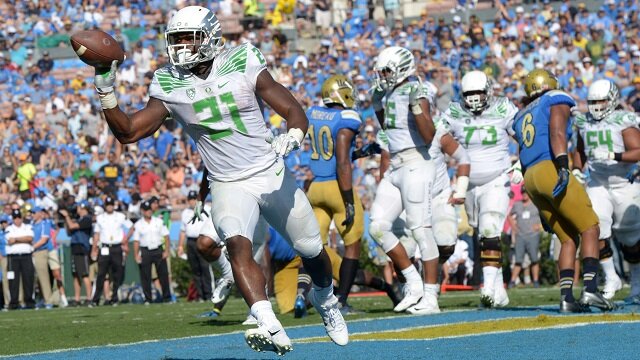 Oregon Ducks running back Royce Freeman (21) celebrates after scoring on a 2-yard touchdown run in the fourth quarter against the UCLA Bruins at Rose Bowl. Oregon defeated UCLA 42-30. 