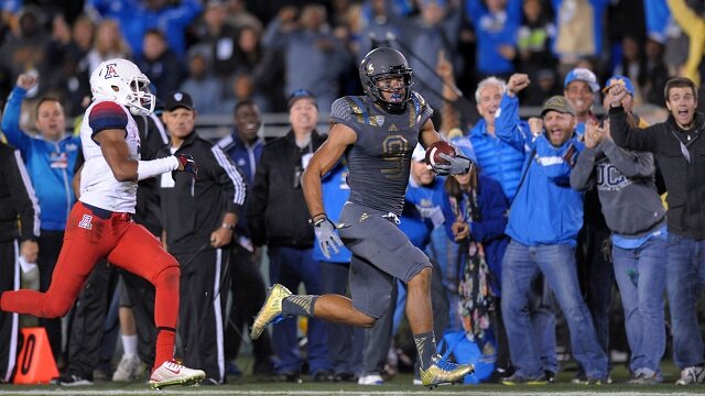 UCLA Bruins wide receiver Jordan Payton (9) runs for a touchdown after making a catch during the third quarter as Arizona Wildcats cornerback Cam Denson (3) gives chase at Rose Bowl. 