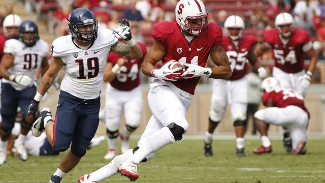 Stanford Cardinal tight end Levine Toilolo (11) runs with the ball after making a catch against the Arizona Wildcats in the second quarter at Stanford Stadium. 