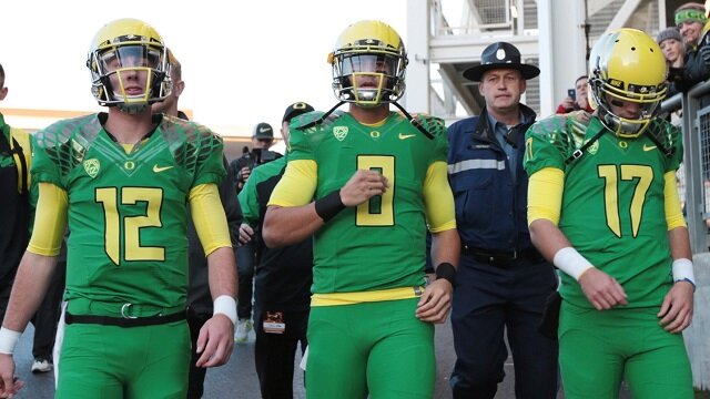 Oregon Ducks quarterback Taylor Alie (12) and quarterback Marcus Mariota (8) and quarterback Jeff Lockie (17) before the game against the Oregon State Beavers at Reser Stadium. 