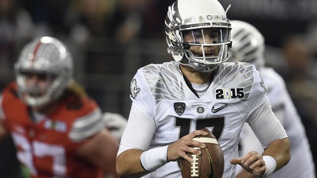Oregon Ducks quarterback Jeff Lockie (17) looks to pass during the fourth quarter against the Ohio State Buckeyes in the 2015 CFP National Championship Game at AT&T Stadium. 