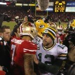 QBs Colin Kaeperick and Aaron Rodgers meet centerfield following 45-31 49ers victory in Divisional Round.