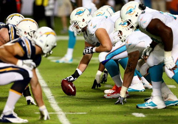 MIAMI GARDENS, FL - NOVEMBER 17: The offensive line of the Miami Dolphins lines up for a play against the San Diego Chargers during their game at Sun Life Stadium on November 17, 2013 in Miami Gardens, Florida. (Photo by Streeter Lecka/Getty Images)